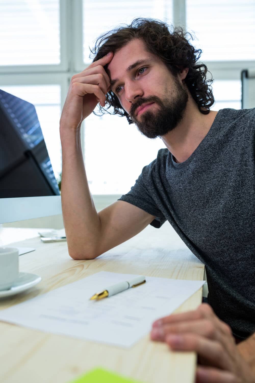 Man sitting thinking about his business start up