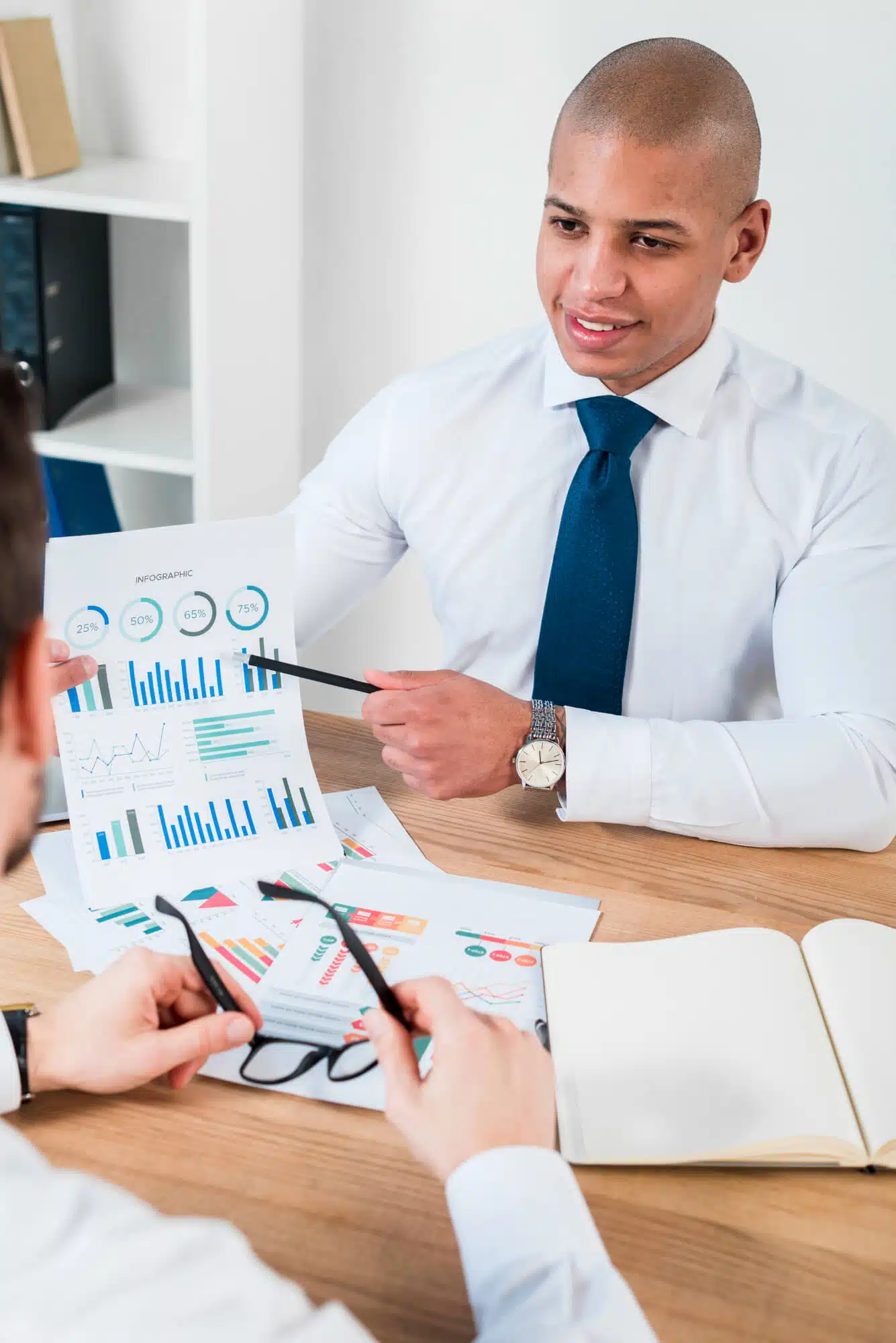 close up smiling businessman showing financial improvement graph